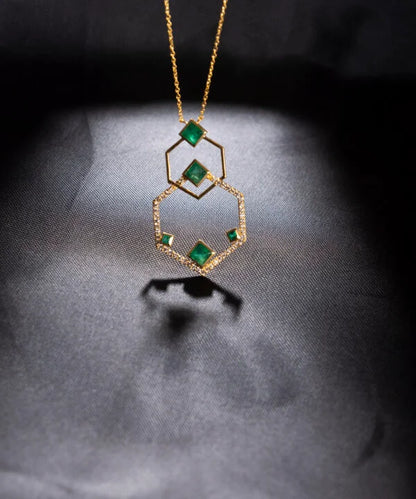 The Intertwined Diamond and Emerald Necklace